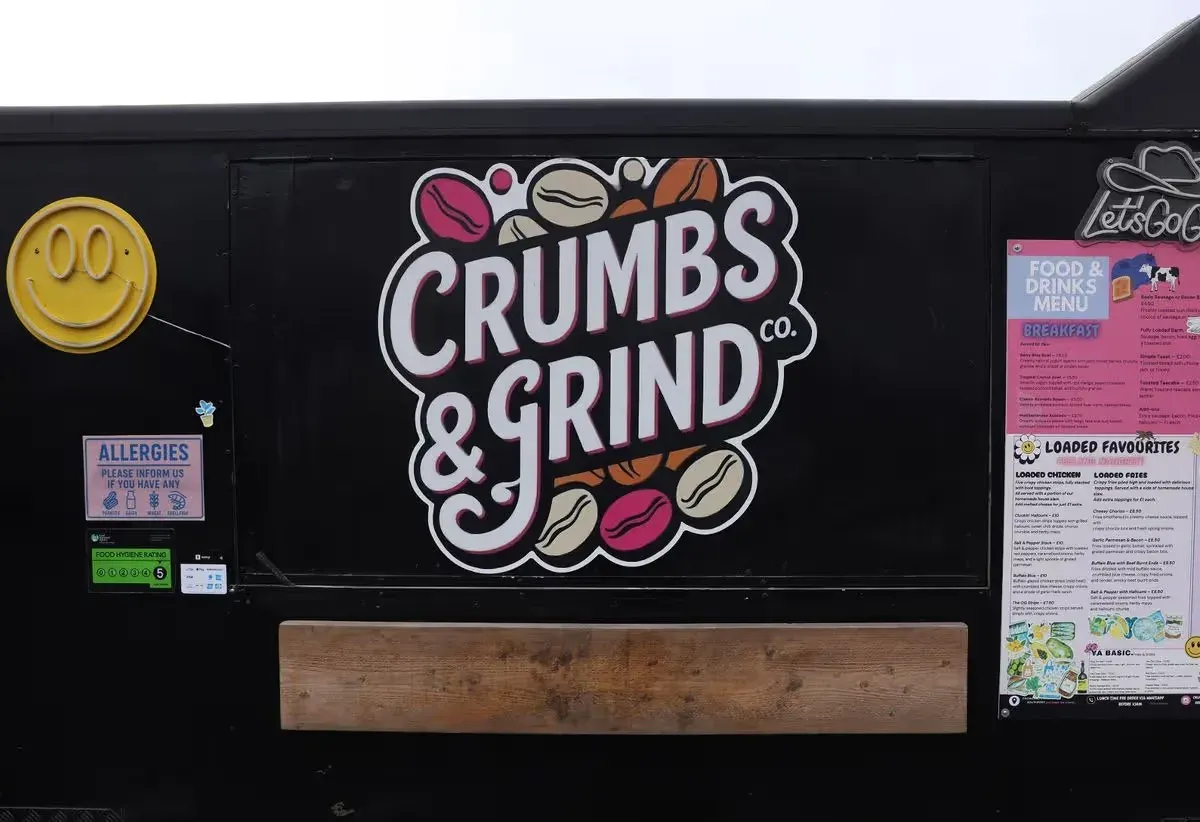 the crumbs & grind co food van on crowland street in southport , full branded menu board and a 5-star food hygiene rating on display